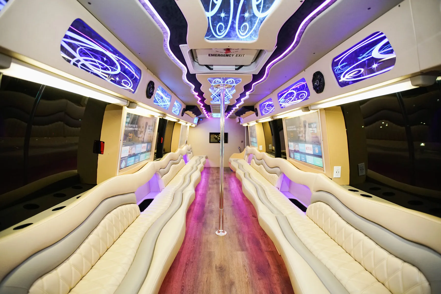 Spacious Capital City party bus interior with white wraparound seating in Raleigh
