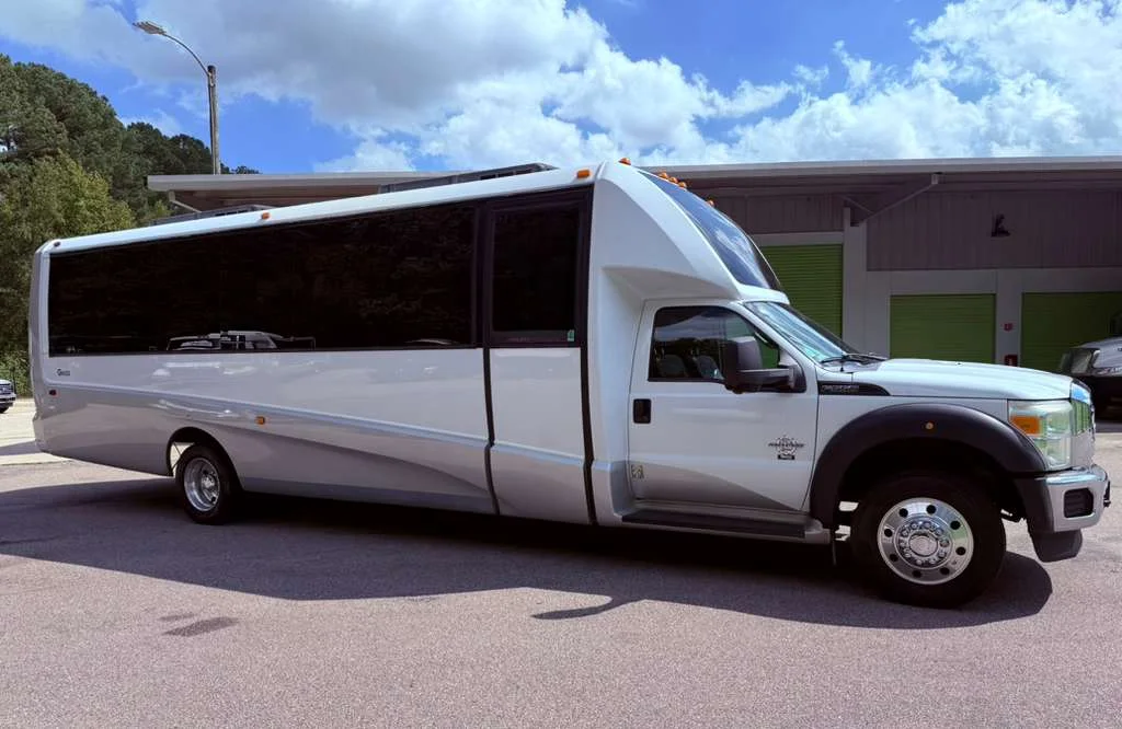 White Capital City executive shuttle shown from the passenger side